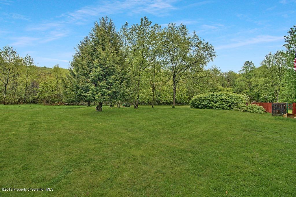 162 Highland Road Dalton, PA 18414 - Photo 30 of 44 a view of a field with trees in the background