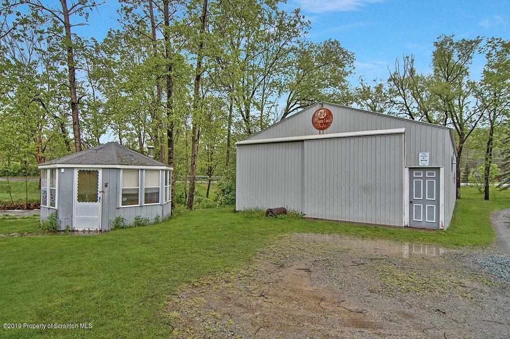 162 Highland Road Dalton, PA 18414 - Photo 31 of 44 a front view of a house with a yard