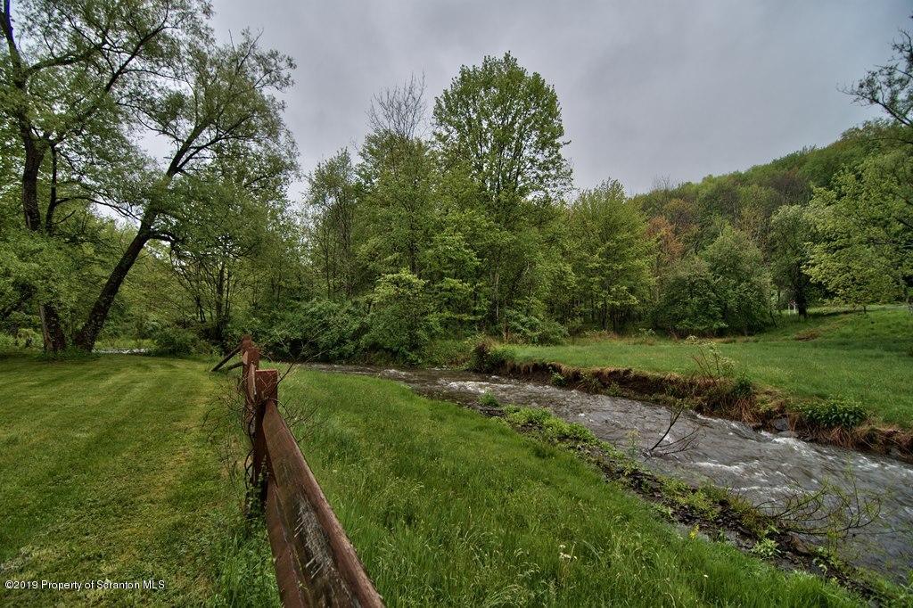 162 Highland Road Dalton, PA 18414 - Photo 36 of 44 a view of a street with a yard