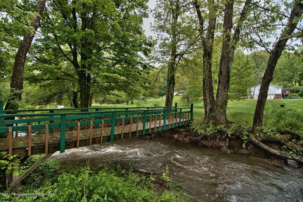 162 Highland Road Dalton, PA 18414 - Photo 37 of 44 a view of lake with green space
