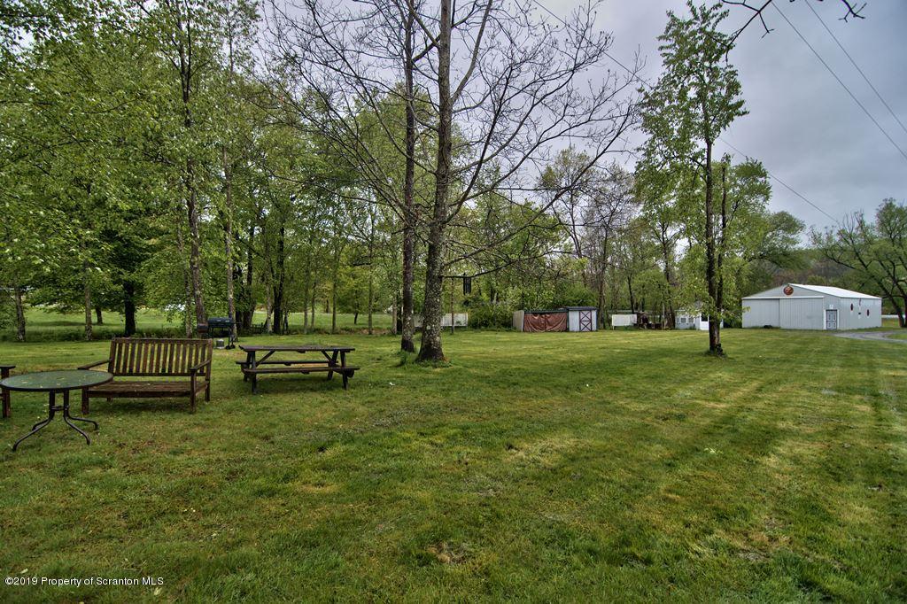 162 Highland Road Dalton, PA 18414 - Photo 38 of 44 a view of a park with bench and trees