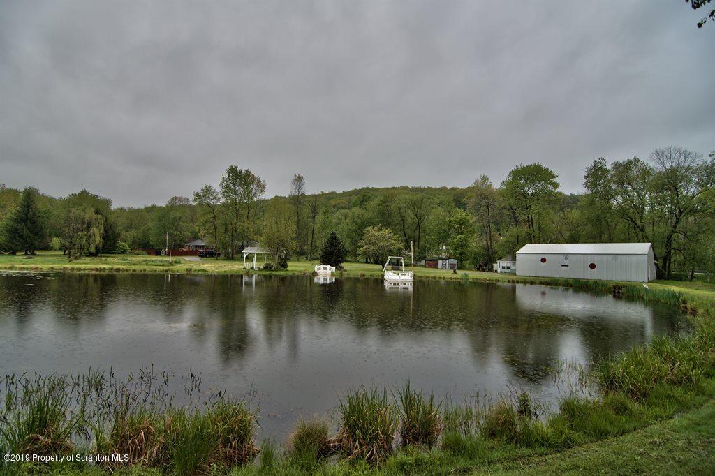 162 Highland Road Dalton, PA 18414 - Photo 40 of 44 an aerial view of residential houses with outdoor space and lake view