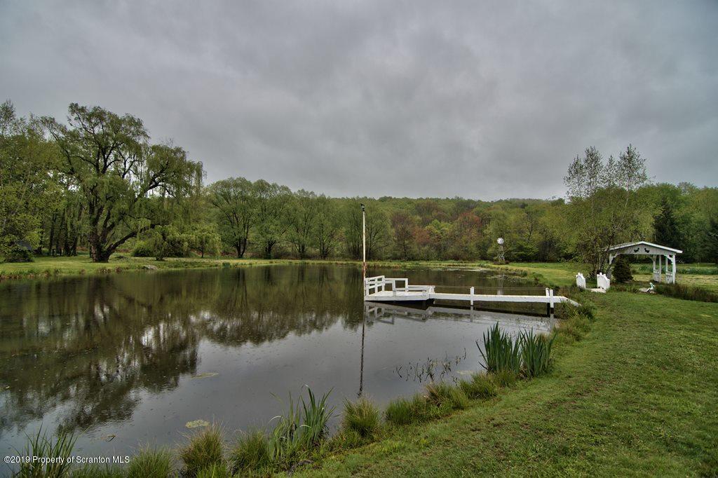 162 Highland Road Dalton, PA 18414 - Photo 41 of 44 a view of a lake with houses in the back
