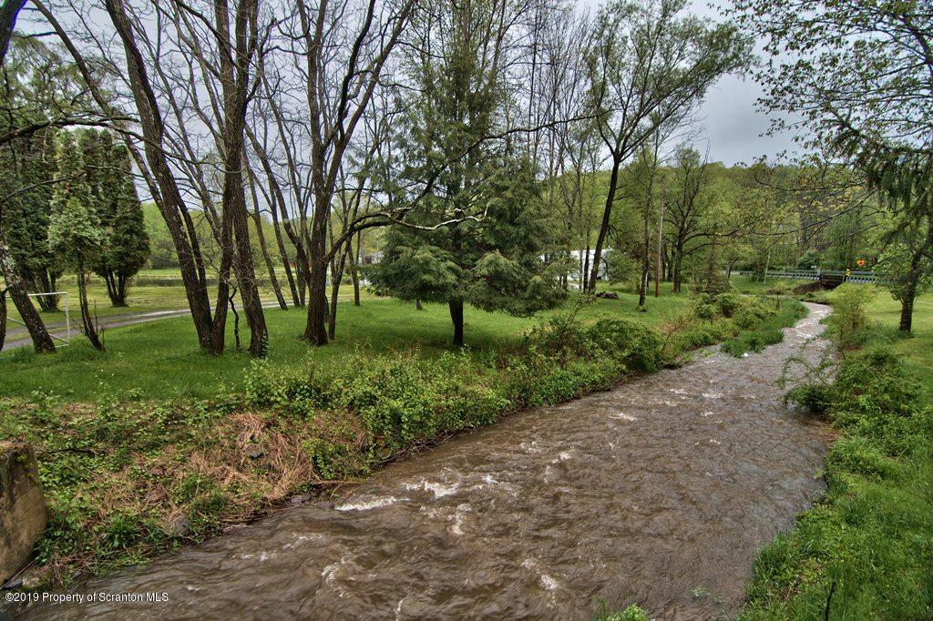 162 Highland Road Dalton, PA 18414 - Photo 43 of 44 a view of a park with large trees