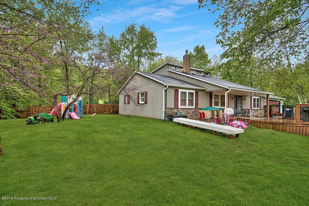 162 Highland Road Dalton, PA 18414 - Photo 6 of 44 a front view of house with yard and outdoor seating