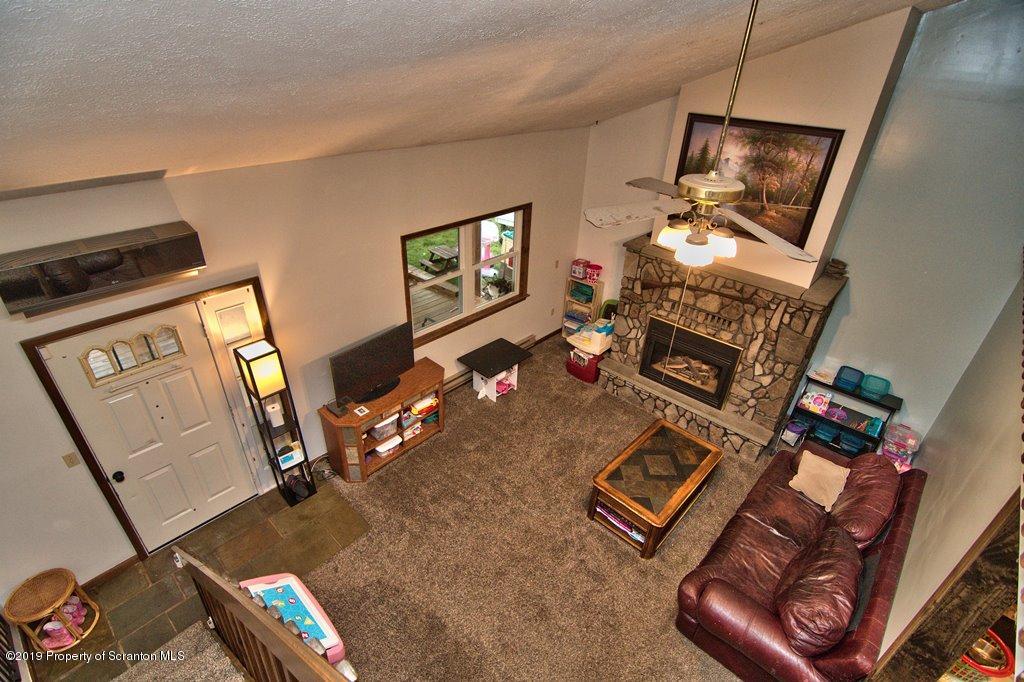 162 Highland Road Dalton, PA 18414 - Photo 9 of 44 a living room with furniture and a flat screen tv