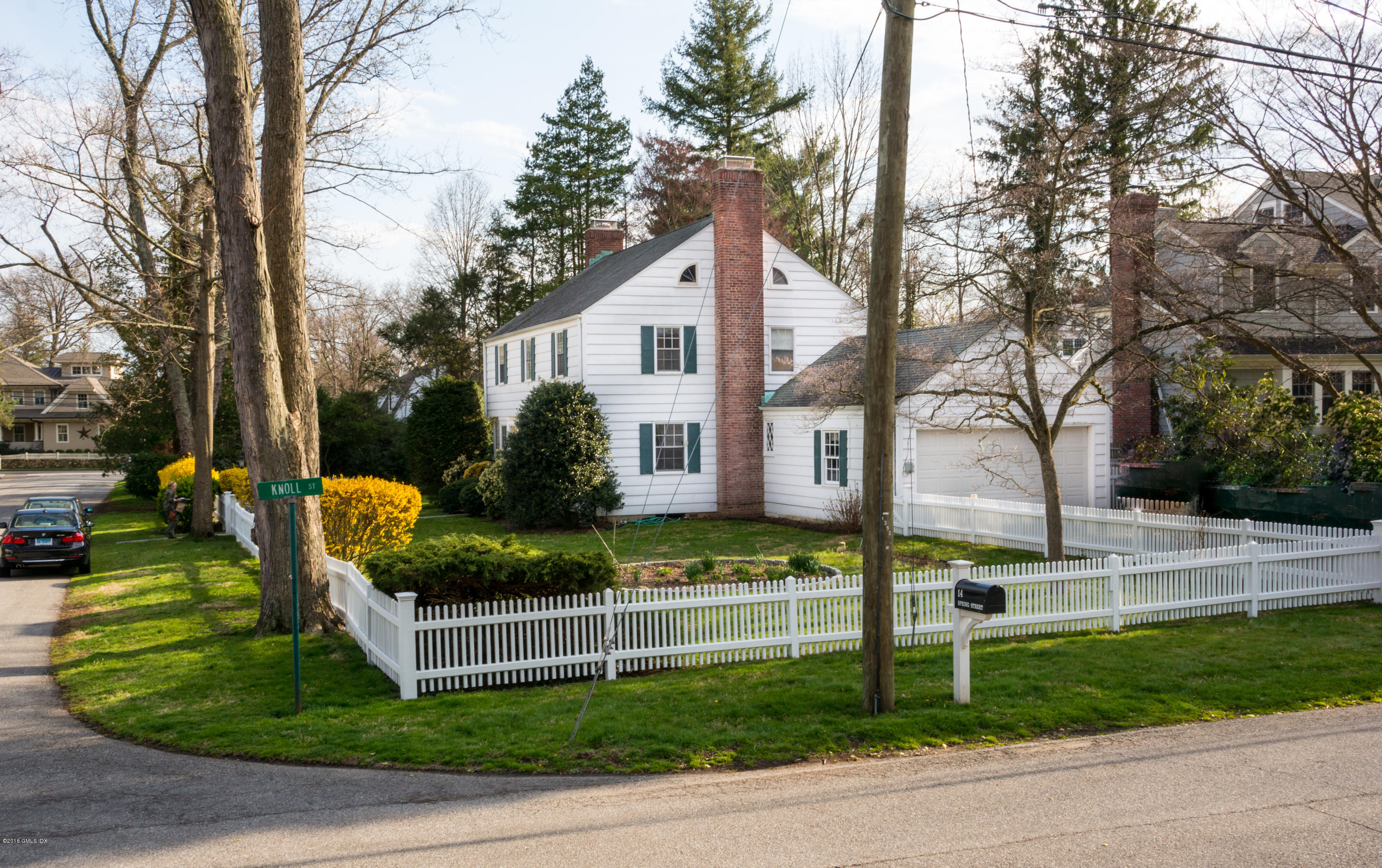 14 Spring Street Riverside, CT 06878 - Photo 1 of 15 a front view of a house with porch and garden