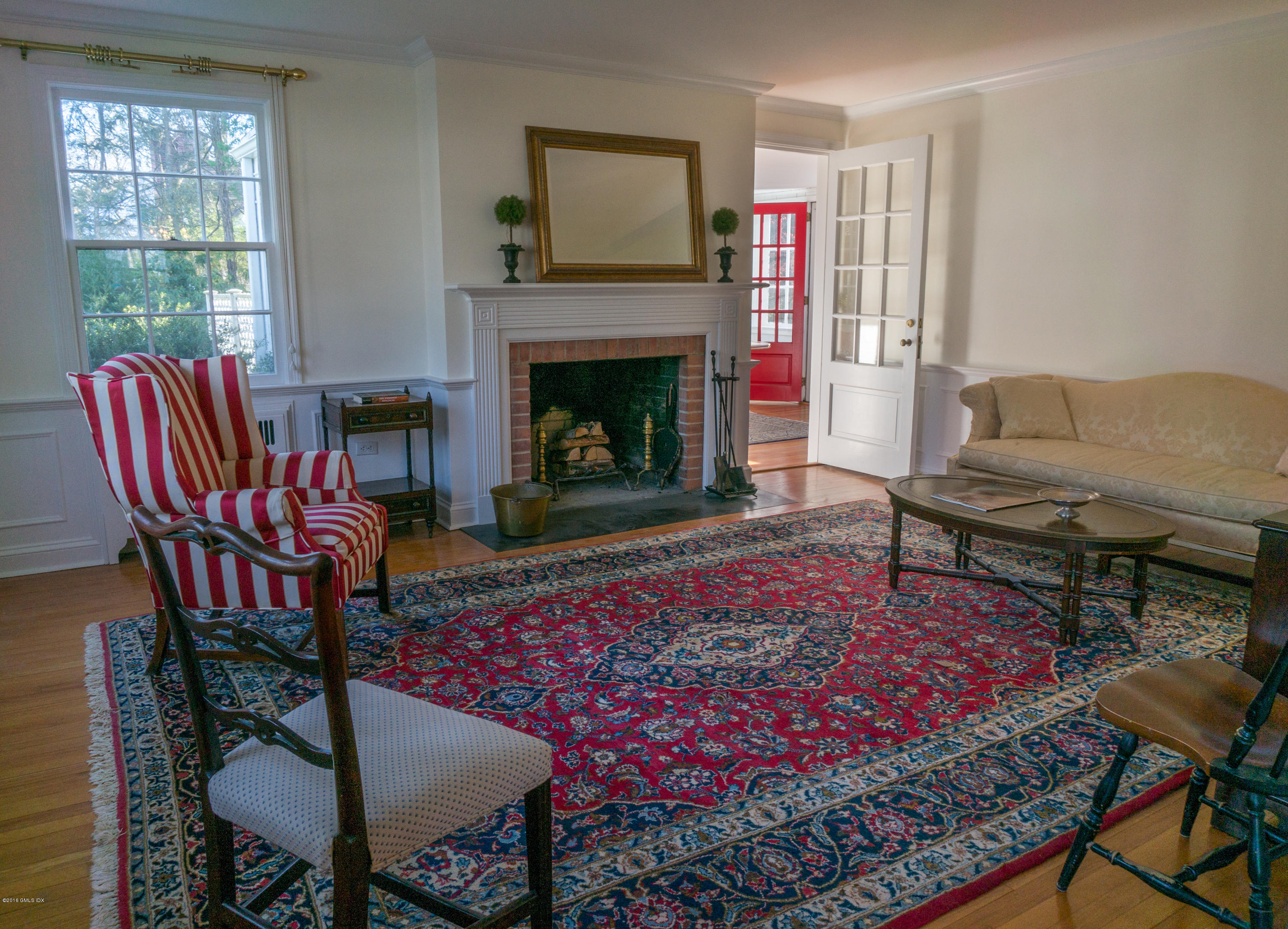 14 Spring Street Riverside, CT 06878 - Photo 3 of 15 a living room with furniture a rug and a fireplace