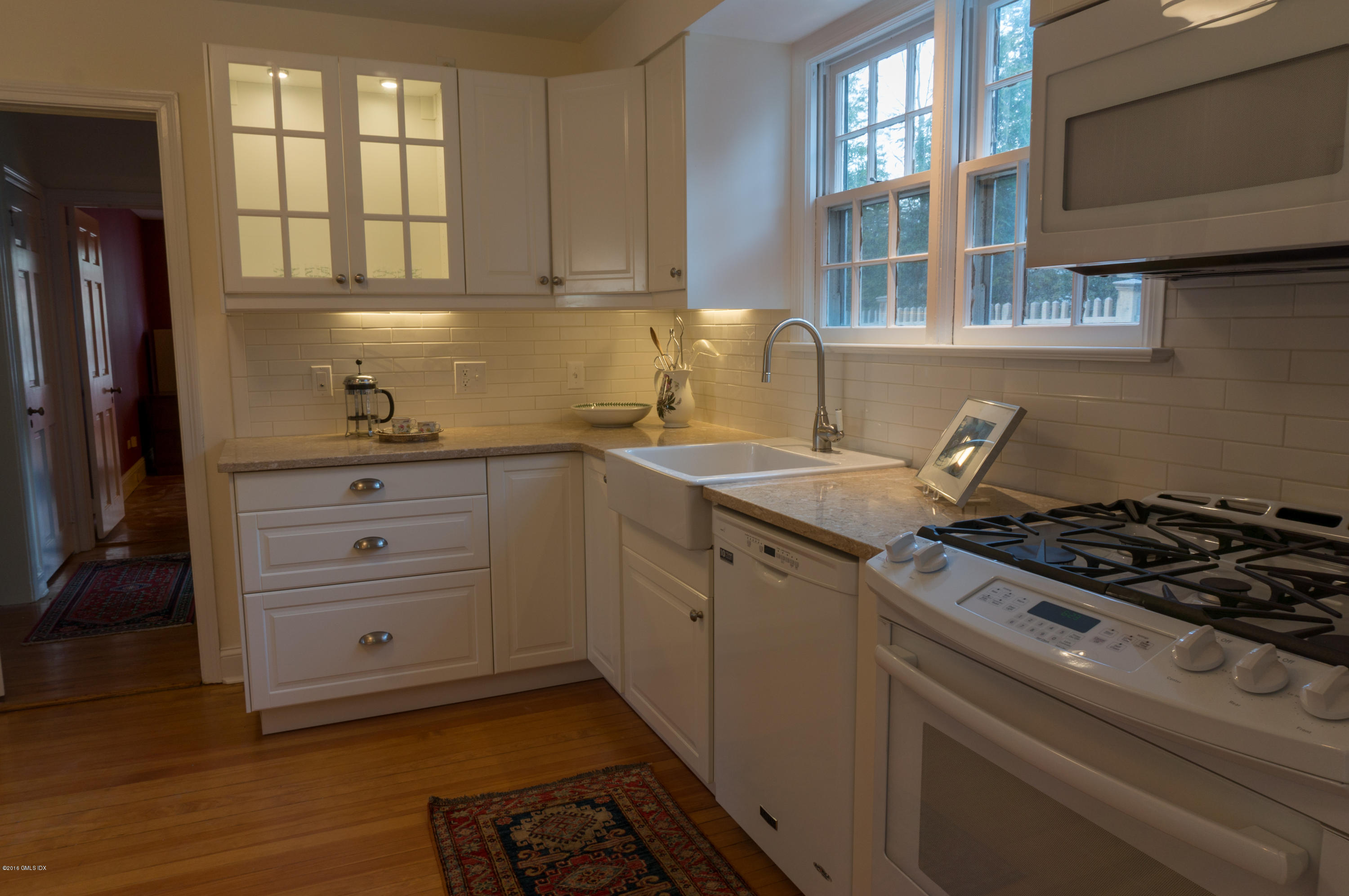 14 Spring Street Riverside, CT 06878 - Photo 7 of 15 a kitchen with granite countertop a stove and a sink