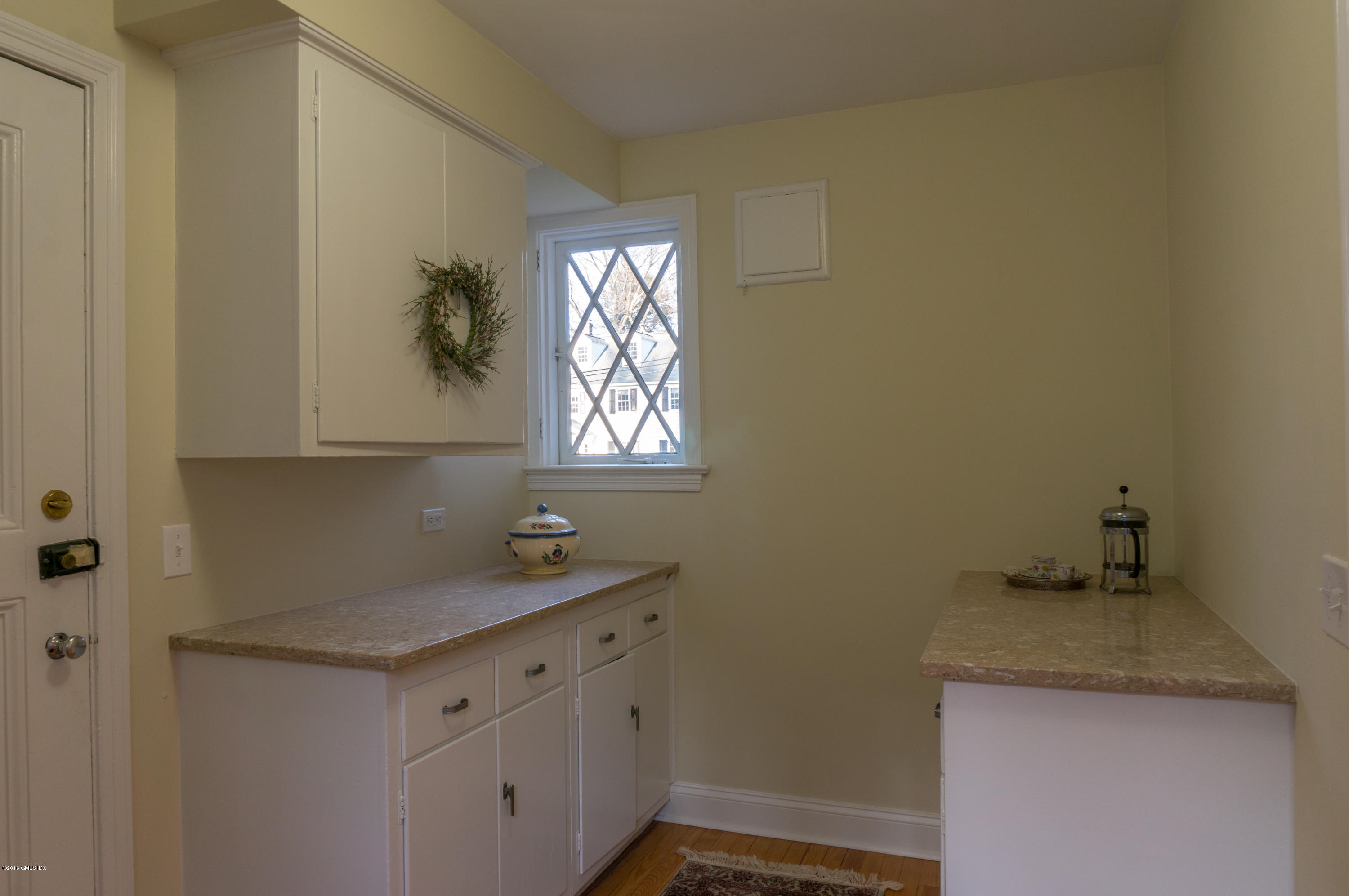 14 Spring Street Riverside, CT 06878 - Photo 8 of 15 a kitchen with a sink and cabinets