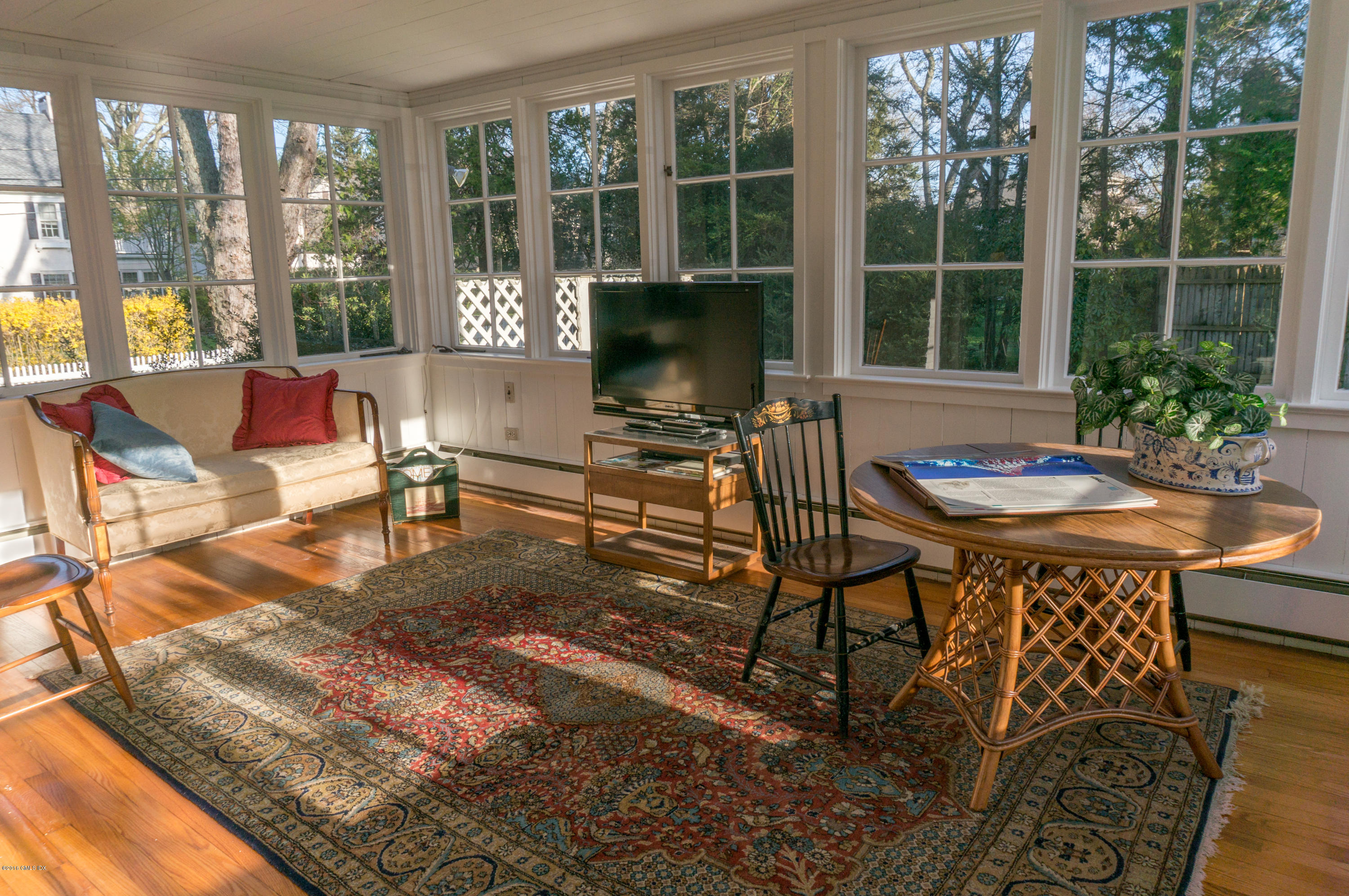 14 Spring Street Riverside, CT 06878 - Photo 9 of 15 a living room with furniture and large windows