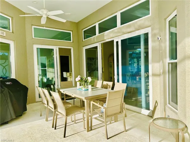 a view of an outside dining space with furniture