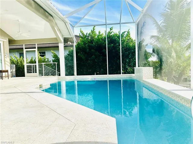 a view of a swimming pool with a porch