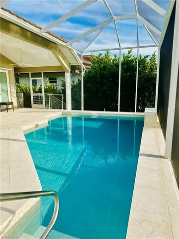a view of swimming pool with seating space