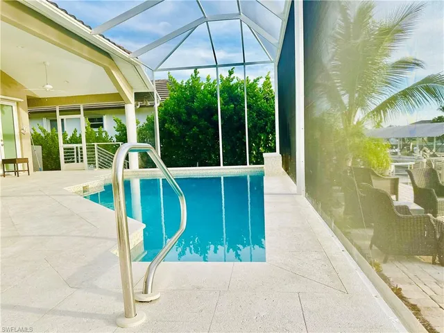 a view of a swimming pool with a patio