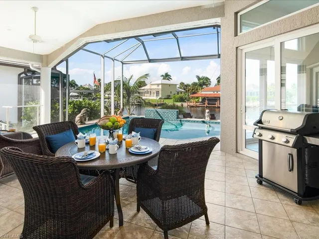 a dining room with furniture mountain view and balcony