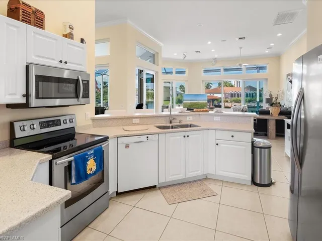 a kitchen with appliances cabinets and a sink
