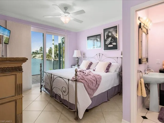 a bed room with a bed and a chandelier