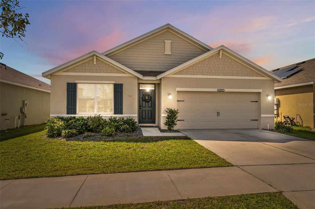a front view of a house with a yard
