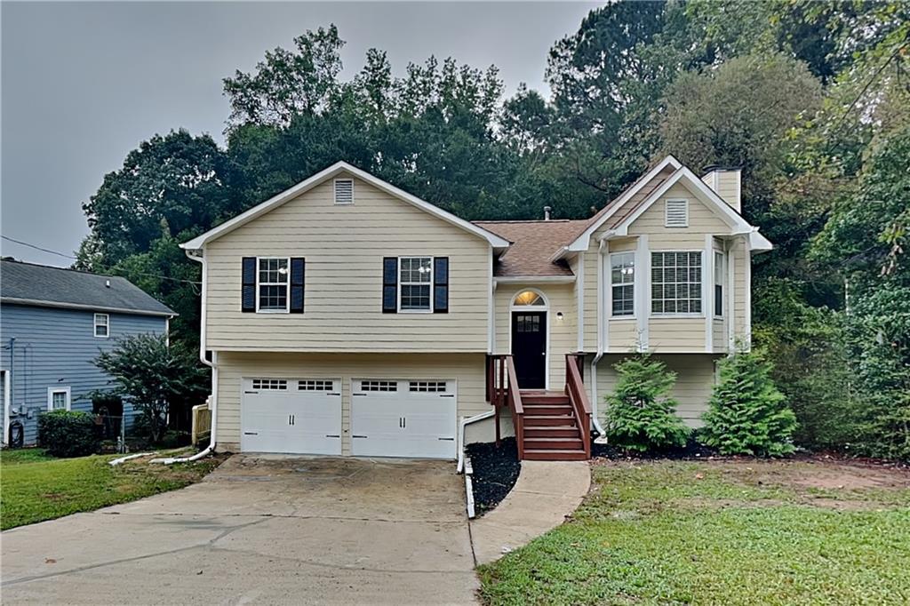a view of house and outdoor space with yard