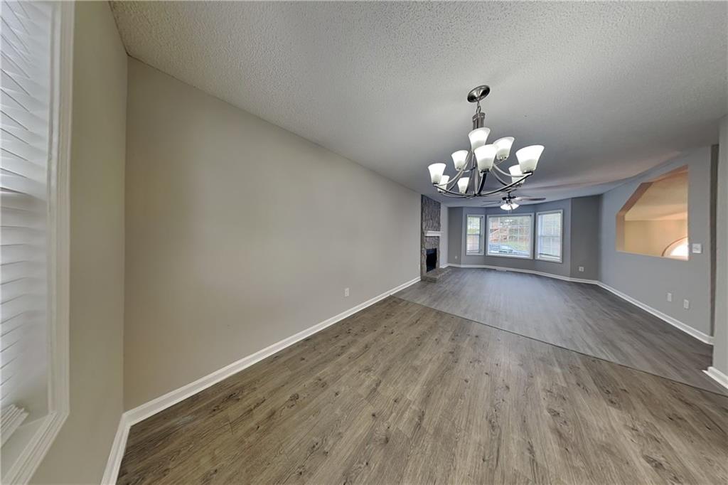 214 Brookside Drive Dallas, GA 30132 - Photo 5 of 20 wooden floor in an empty room with a window