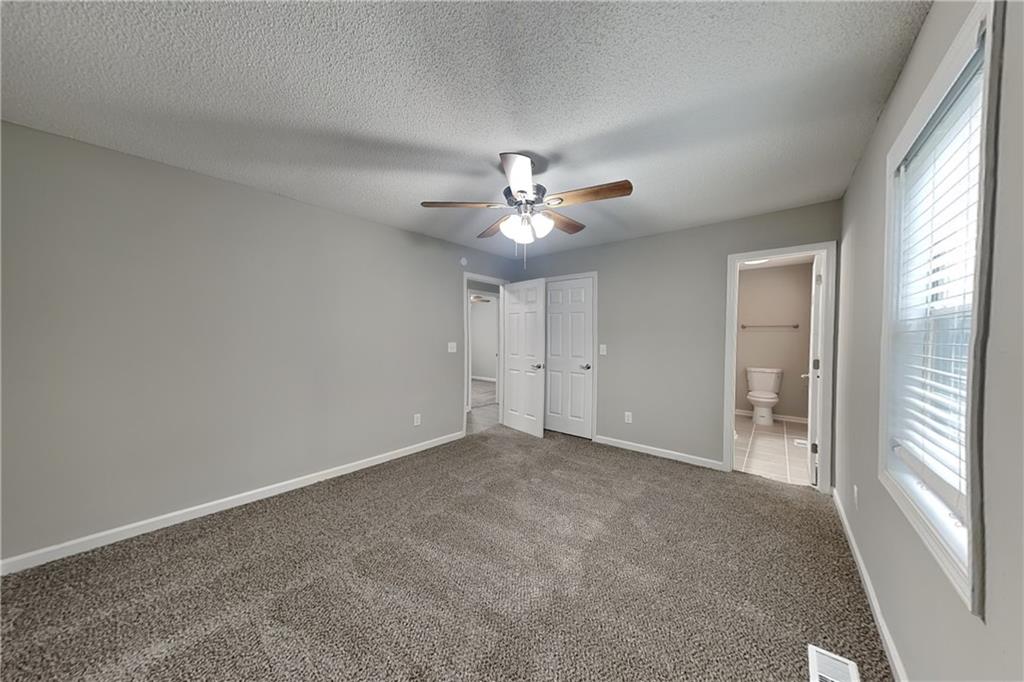 214 Brookside Drive Dallas, GA 30132 - Photo 7 of 20 a view of an empty room with a window