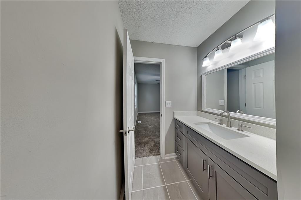 214 Brookside Drive Dallas, GA 30132 - Photo 8 of 20 a bathroom with a double vanity sink and mirror