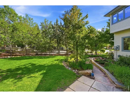 a view of outdoor space with deck and yard