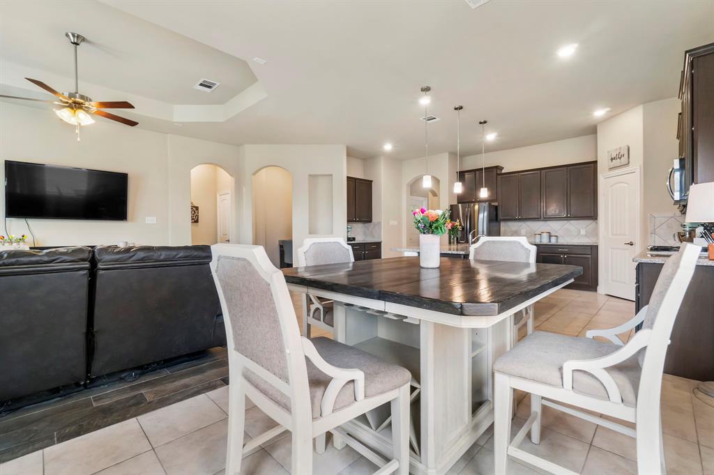 3610 Bastrop Street Melissa, TX 75454 - Photo 12 of 23 a kitchen with stainless steel appliances kitchen island granite countertop a sink and cabinets