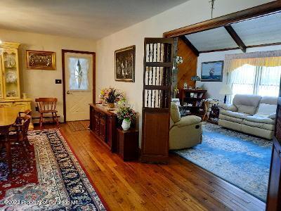 1770 Reservoir Road Moscow, PA 18444 - Photo 8 of 33 a living room with furniture and a rug