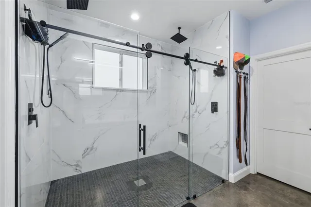 a view of a swimming pool and lounge chairs