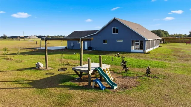 a front view of a house with a garden and yard