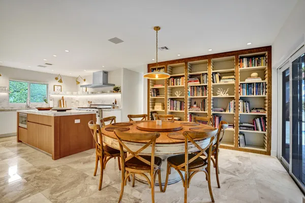 a dining room with furniture and window