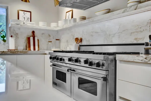 a kitchen with a stove and a sink
