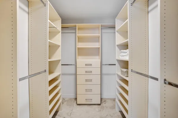 a utility room with closet dryer and washer