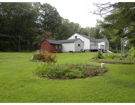 300 Partridge Hill Road Charlton, MA 01507 - Photo 37 of 39 a view of a house with a big yard and large trees