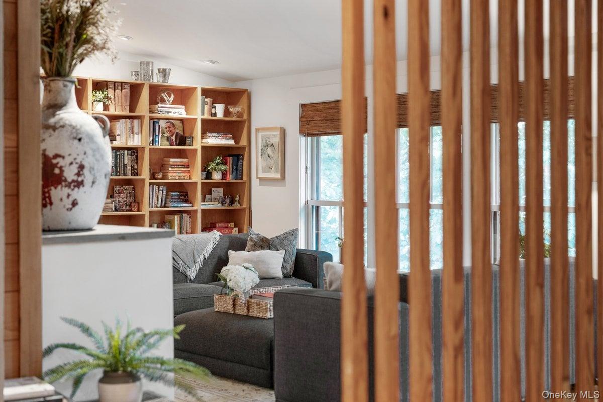 1821 Spring Valley Road Ossining, NY 10562 - Photo 11 of 48 A peek into the living room through the distinctive wood slat wall as you ascend the stairs from the entry level.