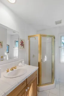 a living room with furniture and a baby crib