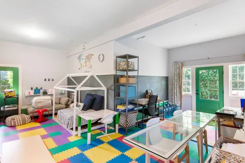 a view of two chairs in the balcony