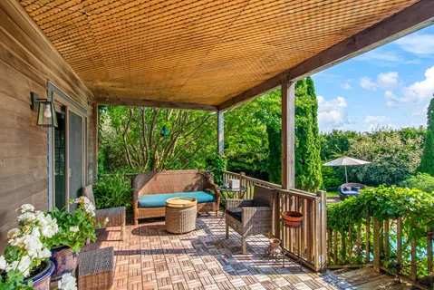an aerial view of residential houses with yard and swimming pool