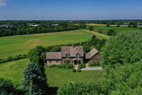 a view of a house with a big yard