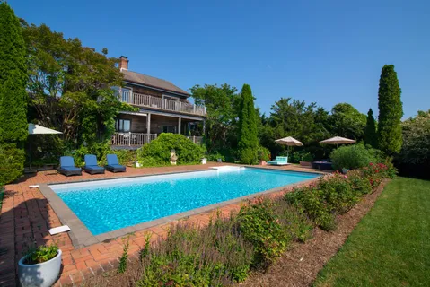 a view of swimming pool from a balcony