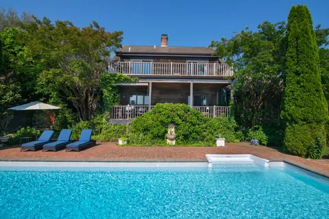 a view of swimming pool with a yard