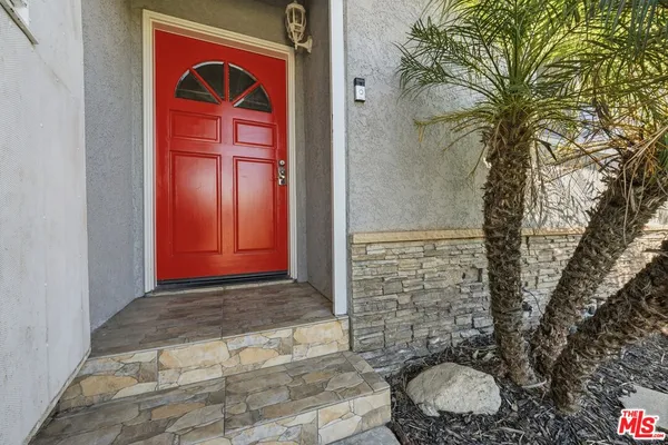 a view of a living room and wooden floor