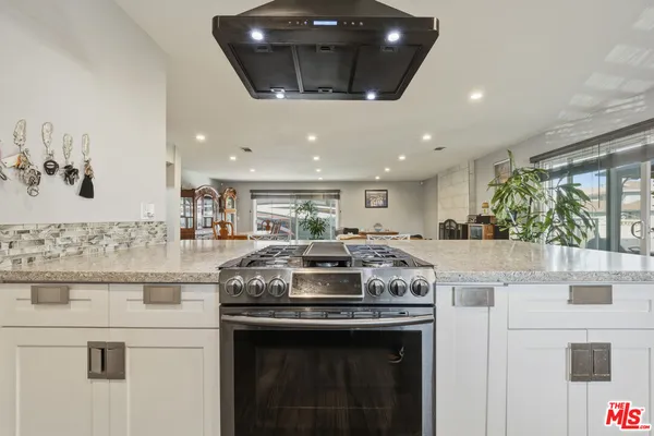 a view of a livingroom with furniture and a fireplace