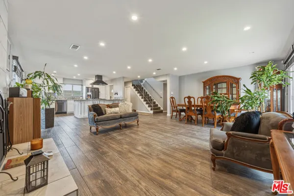 a room with a bed and a flat screen tv