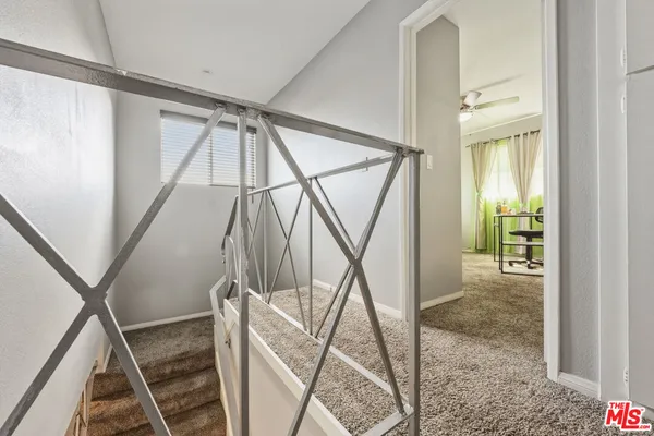 a bedroom with furniture and wooden floor