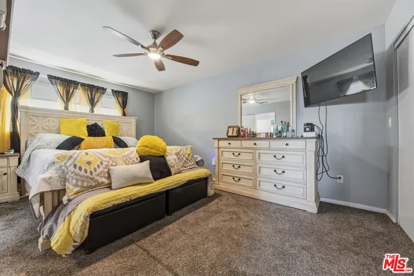 a view of a patio with chair and tables