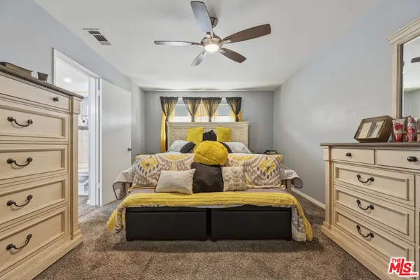 a view of a chairs and table in patio