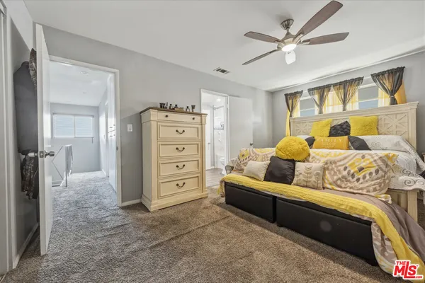 a view of a backyard with furniture and a garden